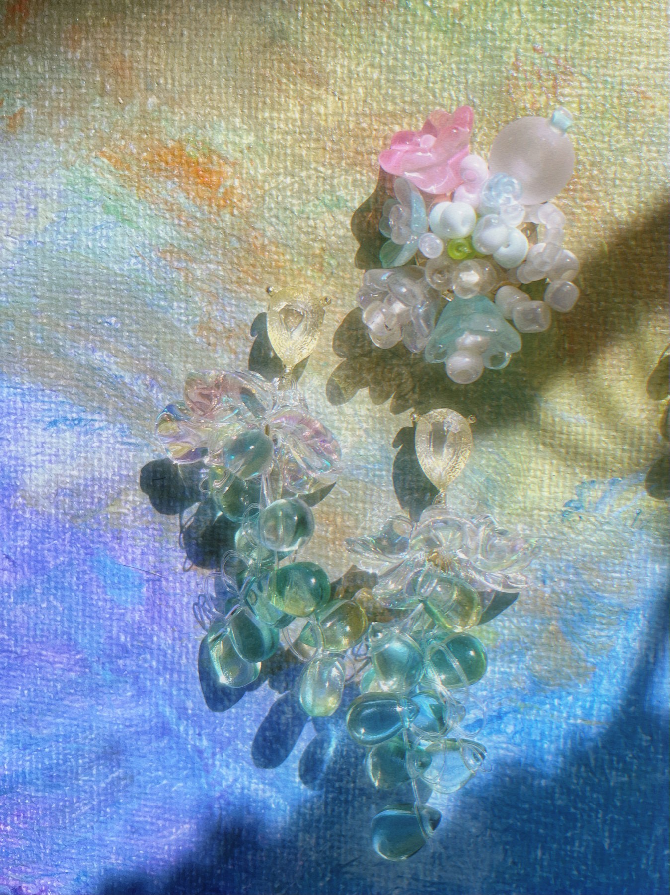 Pastel floral earrings with cascading translucent beads
