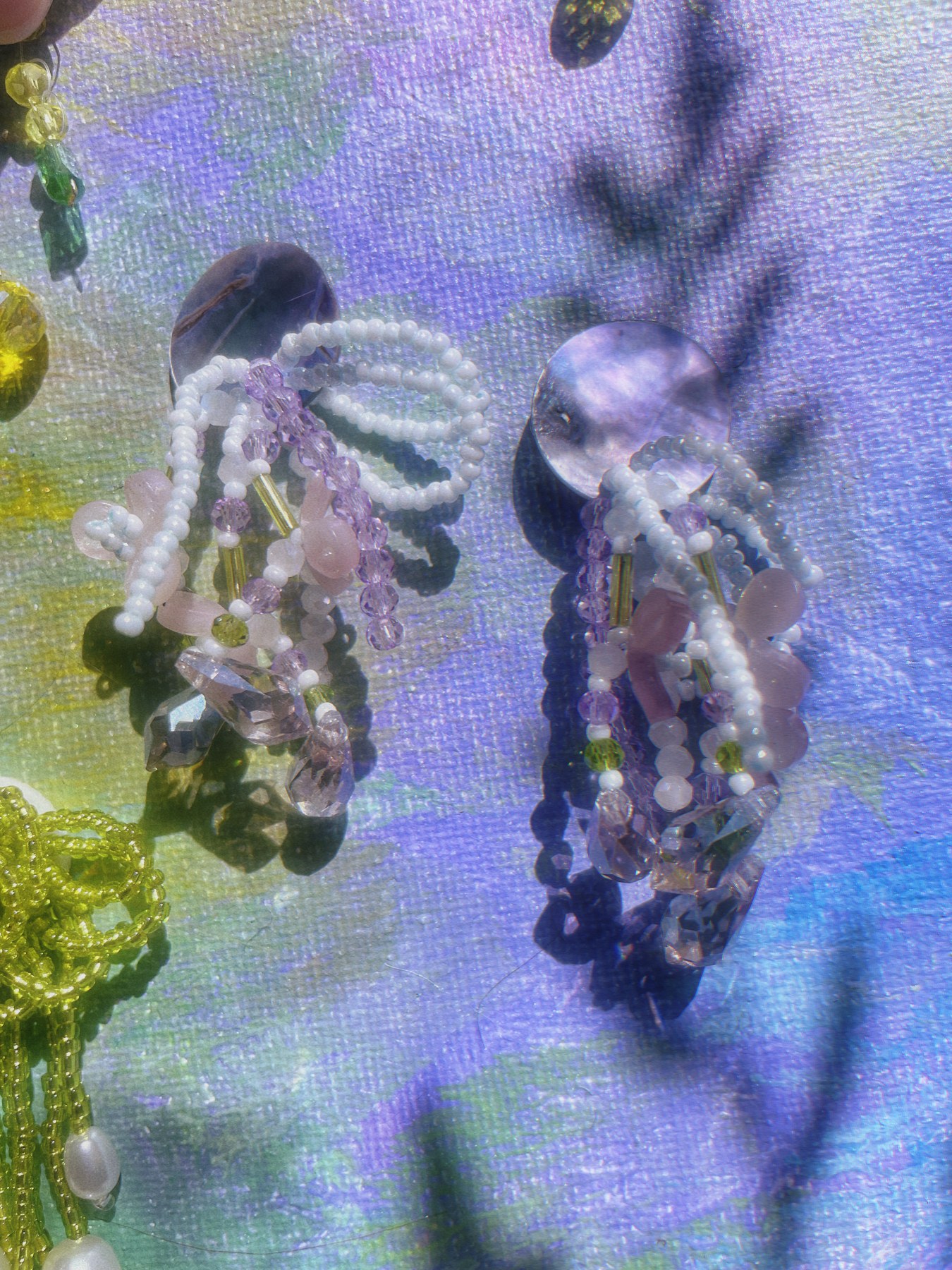 Lavender beaded earrings with delicate hanging strands