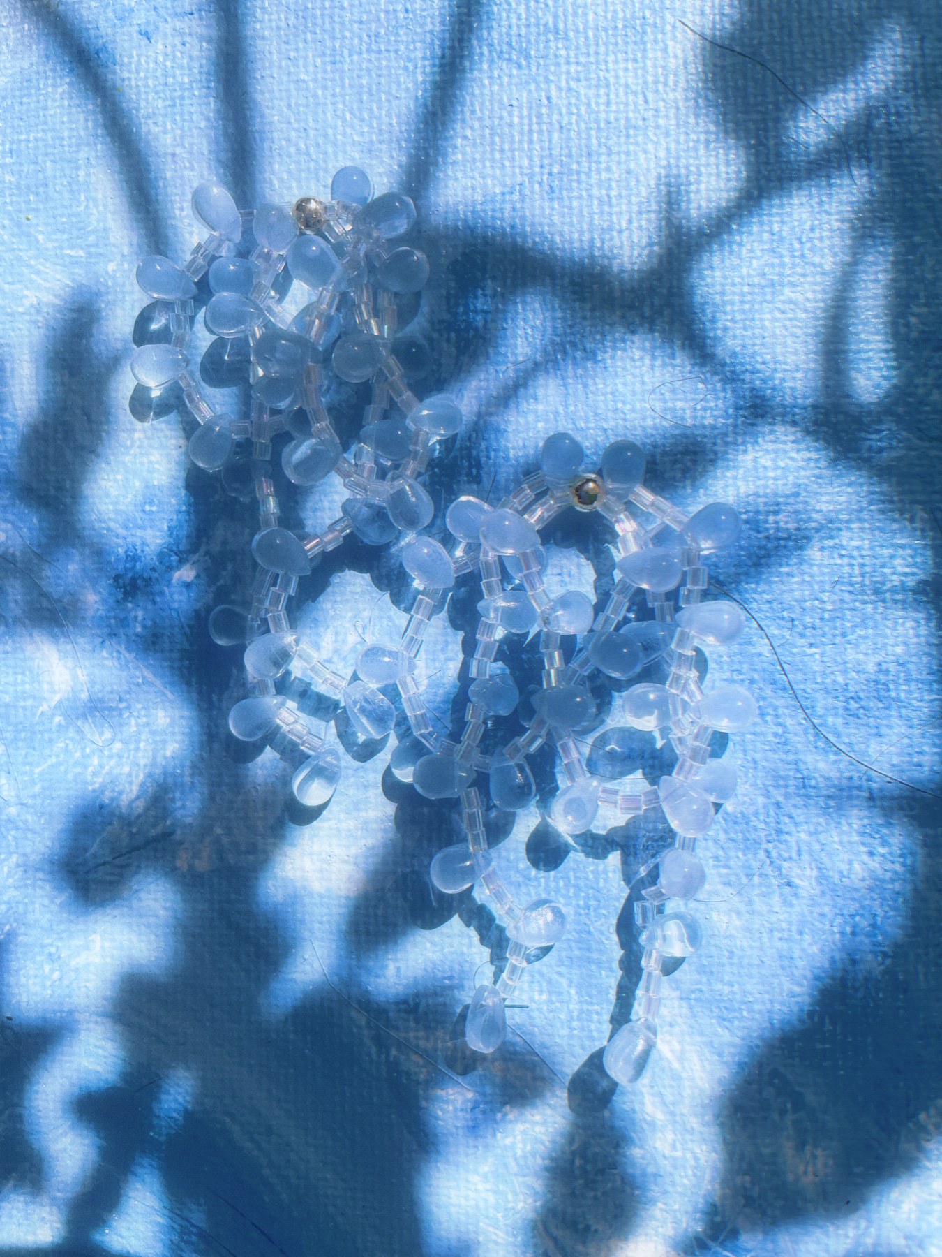 Clear and pale blue cascading earrings